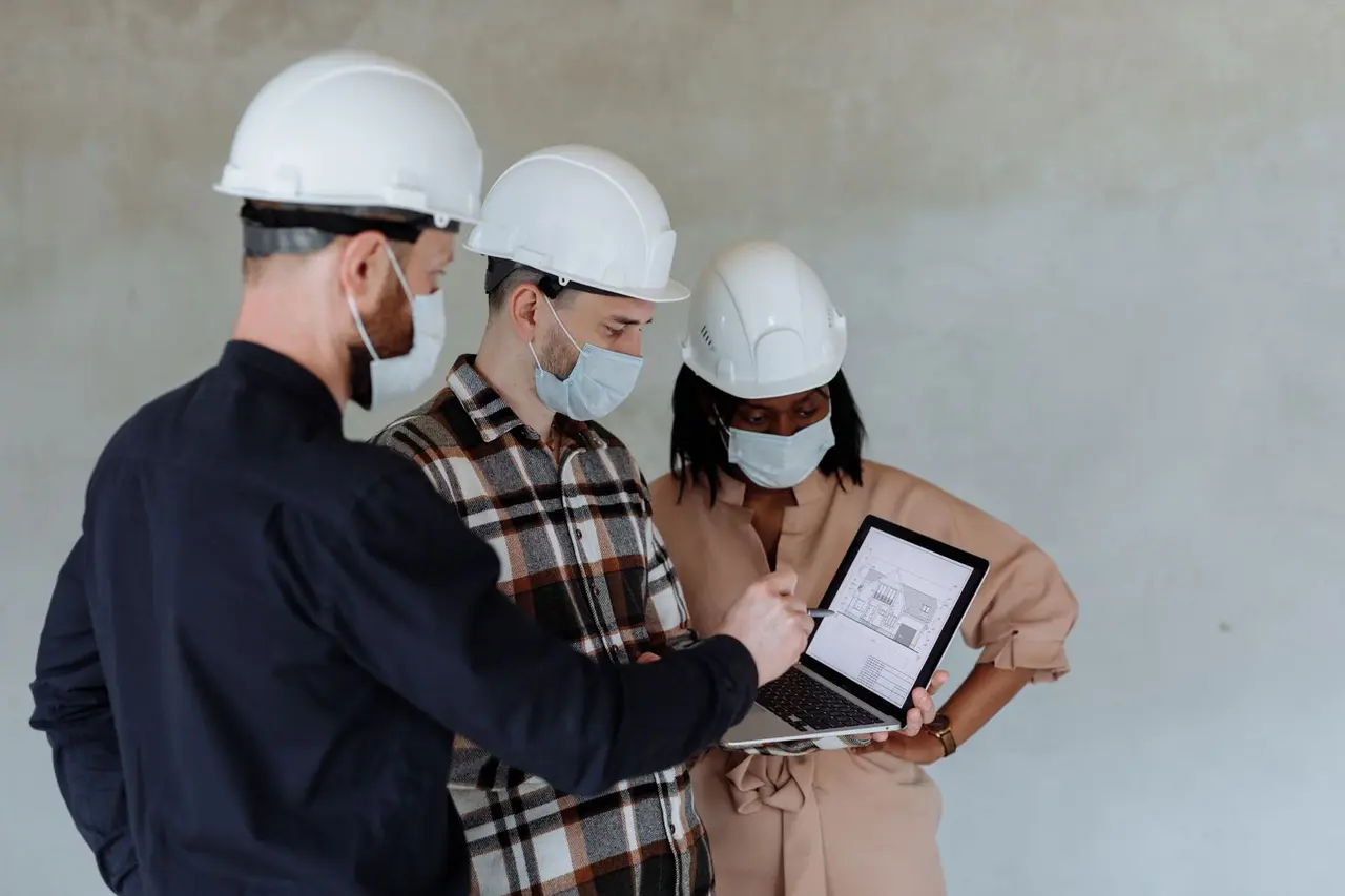 Construction team reviewing project information on a tablet